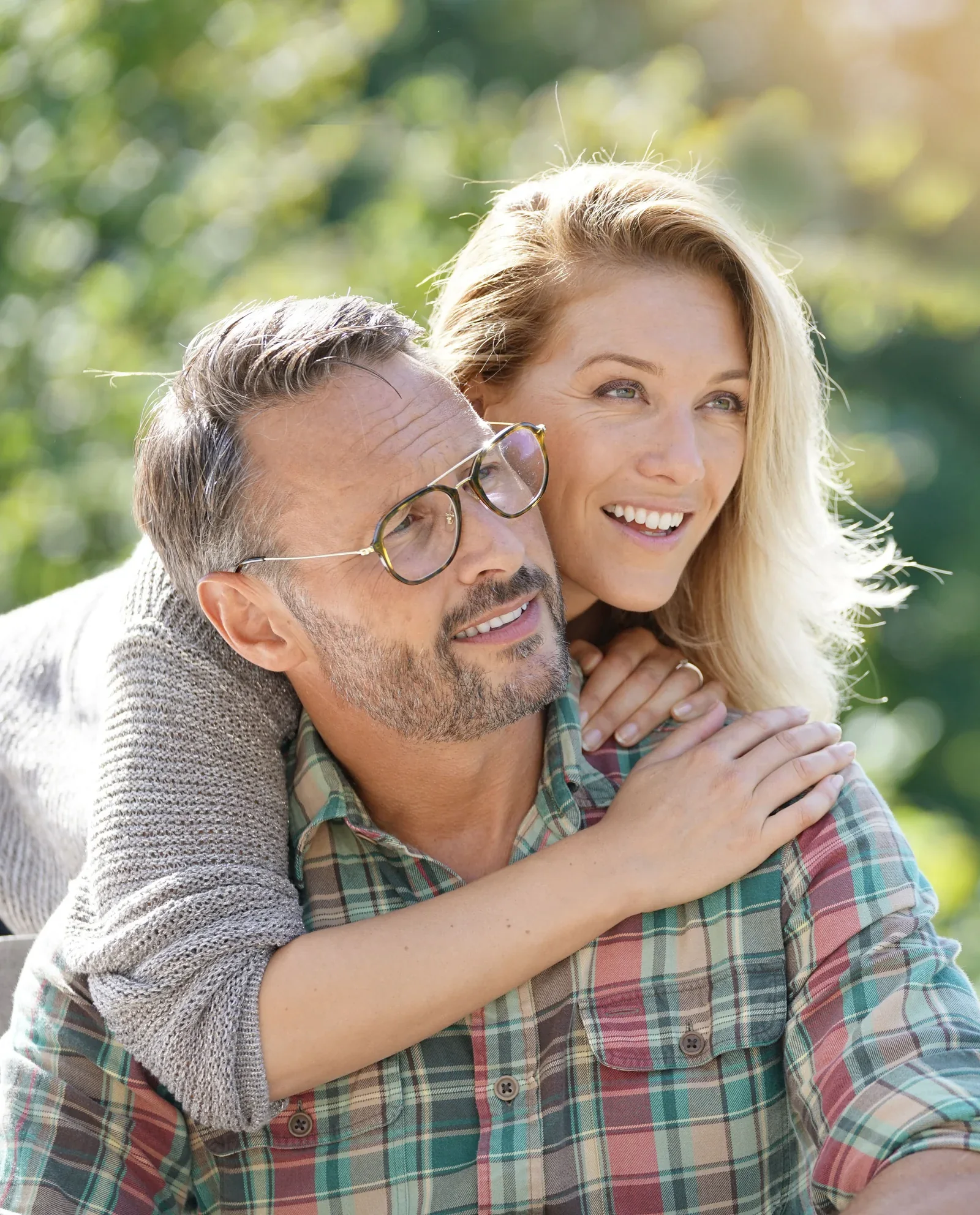 A smiling couple outdoors.