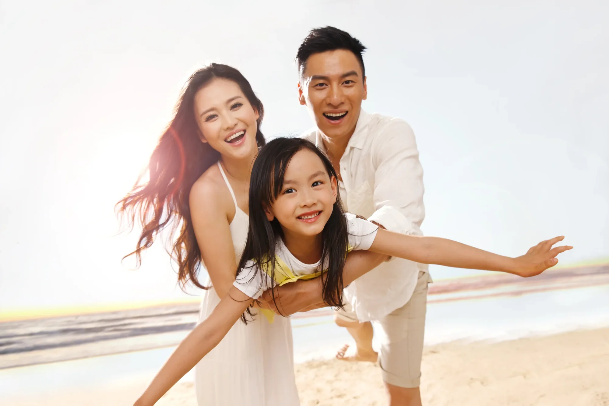 A smiling family enjoying a bright day together.